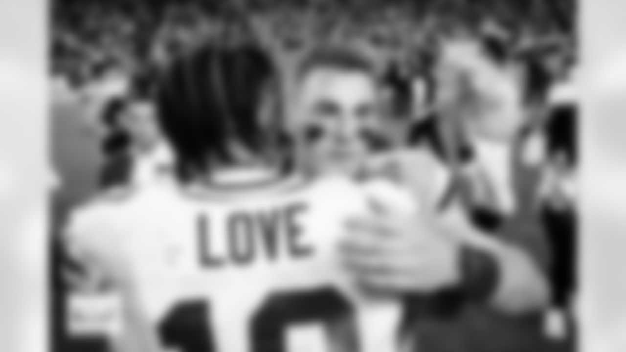 Denver Broncos quarterback Bo Nix (10) and Greenbay Packers quarterback Jordan Love (10) meet at midfield after the Broncos' Week 15 game against the Green Bay Packers at Empower Field at Mile High in Denver, Colorado on December 14, 2025. Photo by Adam Bratten / Denver Broncos