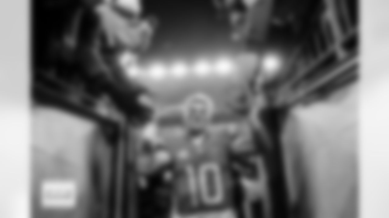 Denver Broncos quarterback Bo Nix (10) high-fives fans as he walks off the field after the Broncos' Divisional Round playoff game against the Buffalo Bills at Empower Field at Mile High in Denver, Colorado on January 17, 2026. Photo by Ben Swanson / Denver Broncos