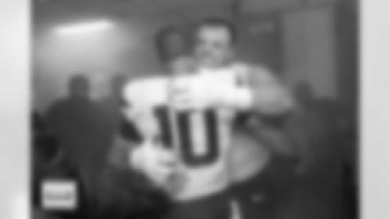 Denver Broncos quarterback Bo Nix (10) hugs Mike McGlinchey in the locker room after the Broncos' Week 5 game against the Philadelphia Eagles at Lincoln Financial Field in Philadelphia, Pennsylvania on October 5, 2025. Photo by Gabriel Christus / Denver Broncos