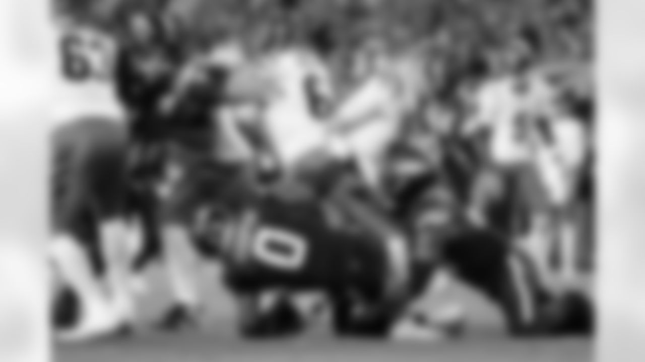 Denver Broncos linebacker Nik Bonitto (15) and linebacker Jonathon Cooper (0) converge on Cincinnati Bengals quarterback Jake Browning (6) for a sack during the Broncos' Week 4 game against the Cincinnati Bengals at Empower Field at Mile High in Denver, Colorado on September 29, 2025. Photo by Adam Bratten / Denver Broncos