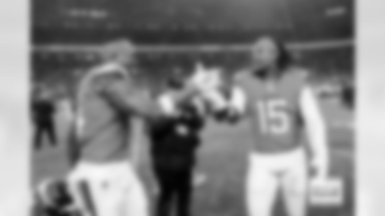 Denver Broncos wide receiver Courtland Sutton (14) celebrates with linebacker Nik Bonitto (15) after the Broncos' Divisional Round playoff game against the Buffalo Bills at Empower Field at Mile High in Denver, Colorado on January 17, 2026. Photo by Ben Swanson / Denver Broncos