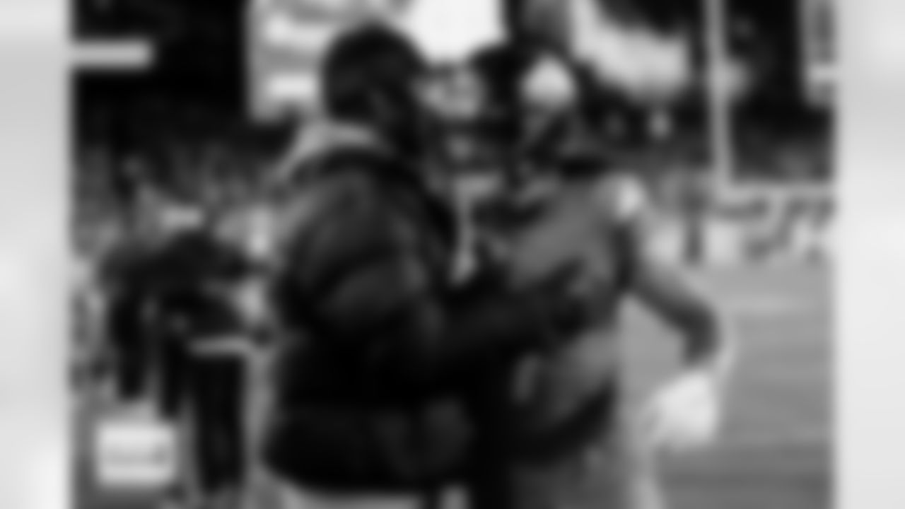 Denver Broncos safety Talanoa Hufanga (9) greets Jayden Daniels before the Broncos' Week 13 game against the Washington Commanders at Northwest Stadium in Landover, Maryland on November 30, 2025. Photo by Ben Swanson / Denver Broncos