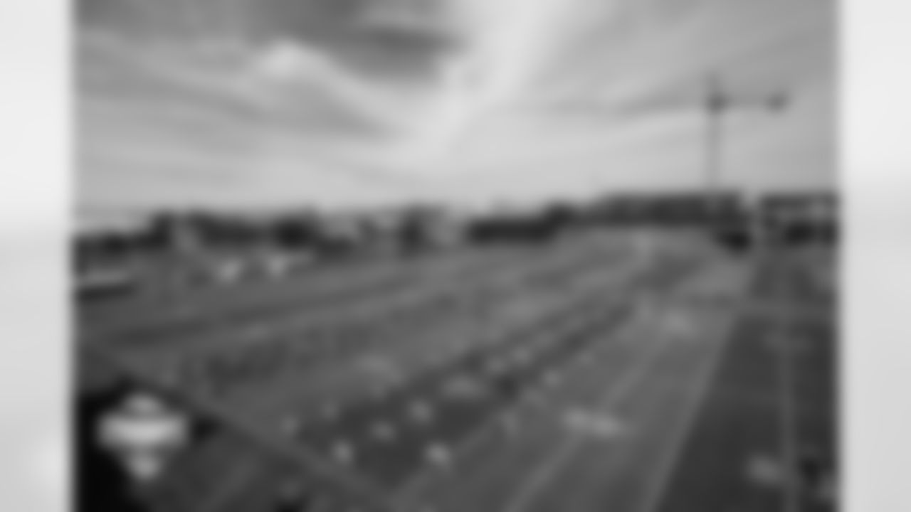 Players warm up in front of fans and facility construction during a training camp practice at Broncos Park Powered by CommonSpirit on July 28, 2025 in Englewood, Colorado. Photo by Ben Swanson / Denver Broncos