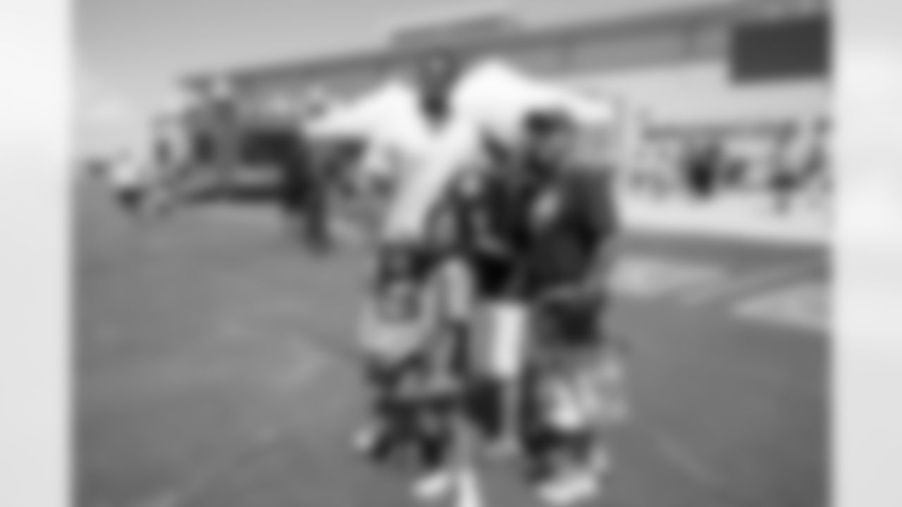 Pat Surtain II takes a photo with people during Baron Browning's Back to School Block Party on Sunday, August 4, 2024 at Broncos Park Powered by CommonSpirit in Englewood, Colorado.
Photo by Gabriel Christus / Denver Broncos