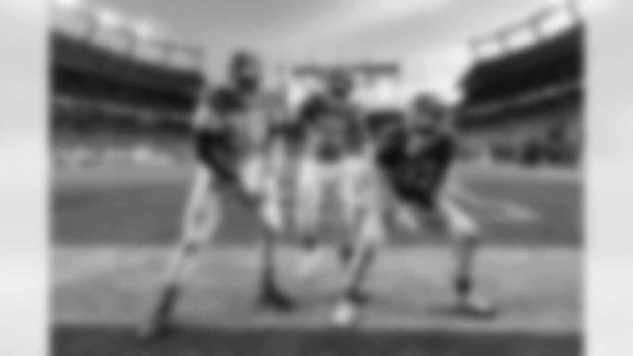 Denver Broncos defensive end Eyioma Uwazurike (96), defensive end Sai'vion Jones (95) and defensive tackle Malcolm Roach (97) celebrate after a fumble recovery during the Broncos' Week 18 game against the Los Angeles Chargers at Empower Field at Mile High in Denver, Colorado on January 4, 2026. Photo by Ben Swanson / Denver Broncos