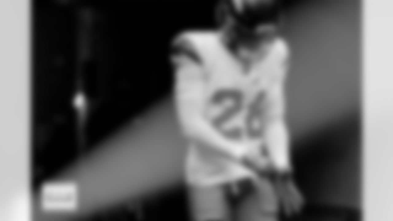 Denver Broncos safety Devon Key (26) adjusts his gloves as he walks out of the tunnel before the Broncos' Week 9 game against the Houston Texans at NRG Stadium in Houston, Texas on November 2, 2025. Photo by Gabriel Christus / Denver Broncos