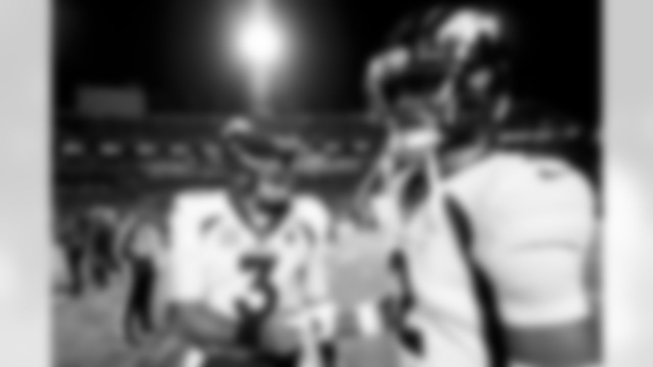 Russell Wilson and Pat Surtain II before the Broncos' Week 10 game against the Buffalo Bills at Highmark Stadium in Orchard Park, New York on November 13, 2023.