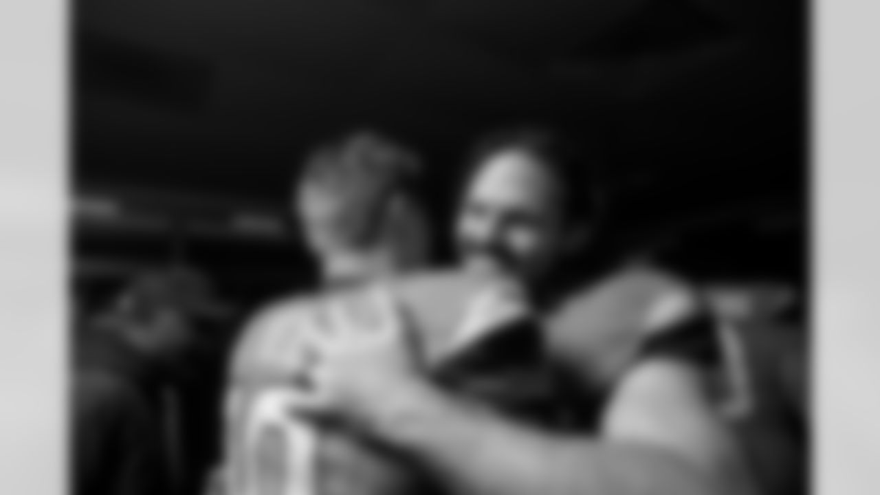 Denver Broncos linebacker Alex Singleton (49) hugs quarterback Bo Nix (10) in the locker room after the Broncos' Week 13 game against the Washington Commanders at Northwest Stadium in Landover, Maryland on November 30, 2025. Photo by Gabriel Christus / Denver Broncos