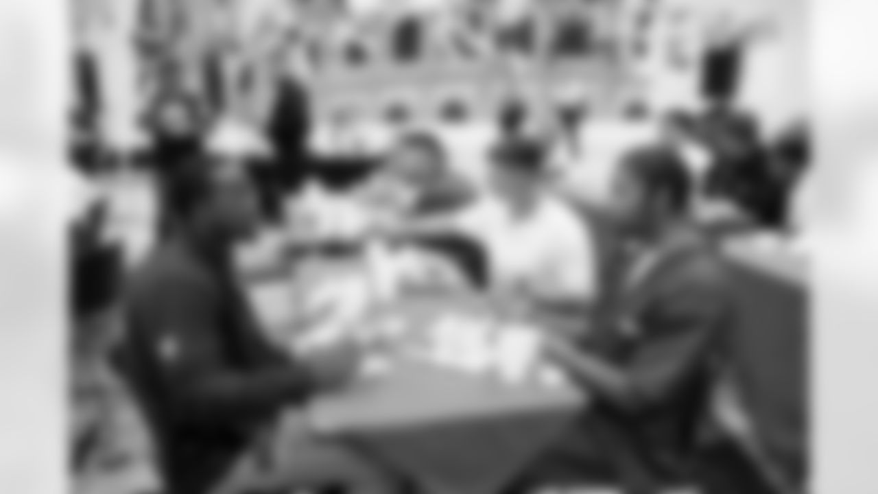 Georry Desruisseaux talks with inmates at lunch during a visit to the Arkansas Valley Correctional Facility in Ordway, Colorado on October 14, 2025. In partnership with the Vera Institute of Justice, the Denver Broncos Foundation toured ChangeMakers Village (a Restoring Promise Unit).Photo by Gabriel Christus / Denver Broncos