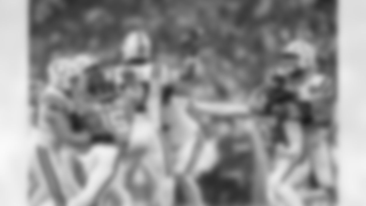 Denver Broncos linebacker Nik Bonitto (15) and linebacker Jonathon Cooper (0) pressure Indianapolis Colts quarterback Daniel Jones (17) during the Broncos' Week 2 game against the Indianapolis Colts at Lucas Oil Stadium in Indianapolis, Indiana on September 14, 2025. Photo by Gabriel Christus / Denver Broncos