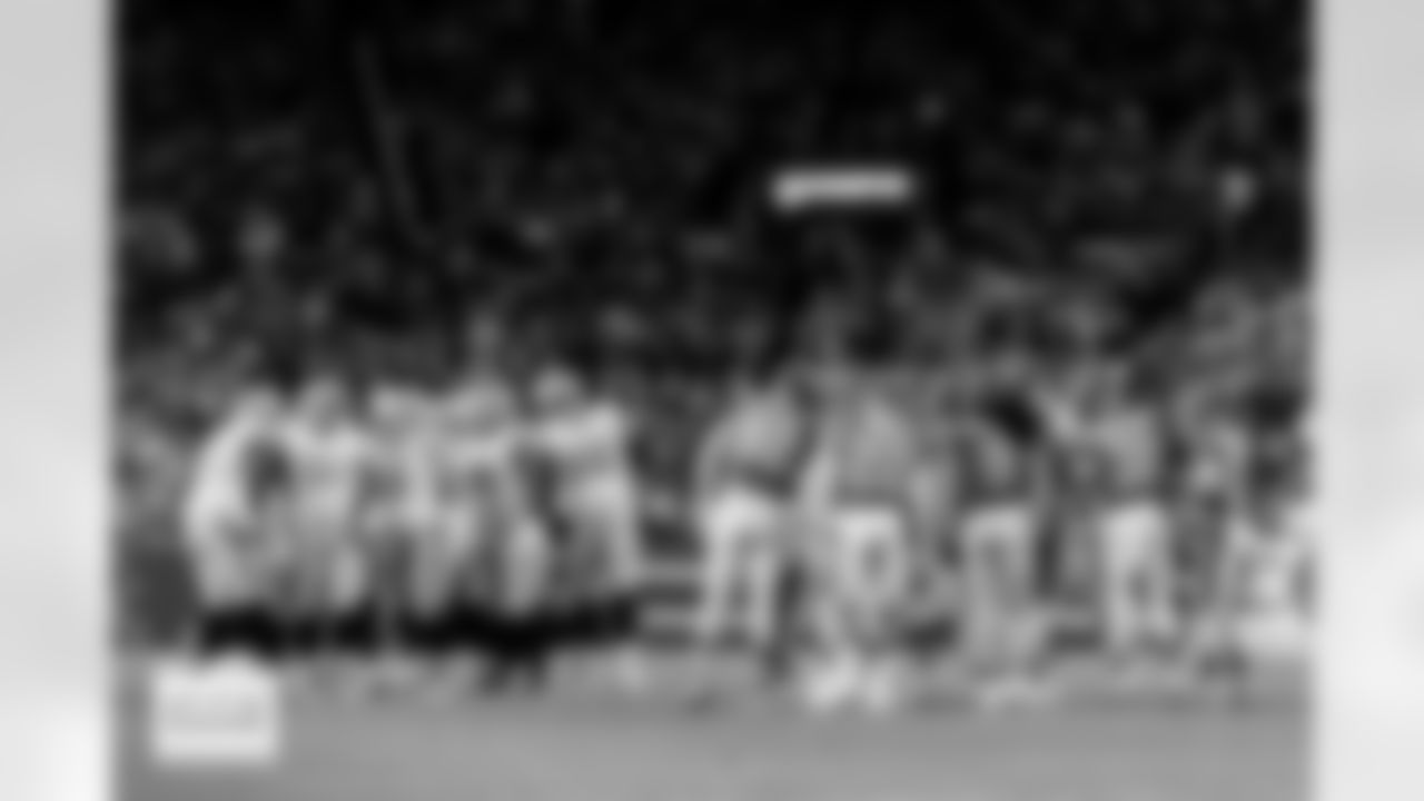 The Denver Broncos defense and the Las Vegas Raiders offense in a huddle during the Broncos' Week 10 game against the Las Vegas Raiders at Empower Field at Mile High in Denver, Colorado on November 6, 2025. Photo by Gavin Liddell / Denver Broncos