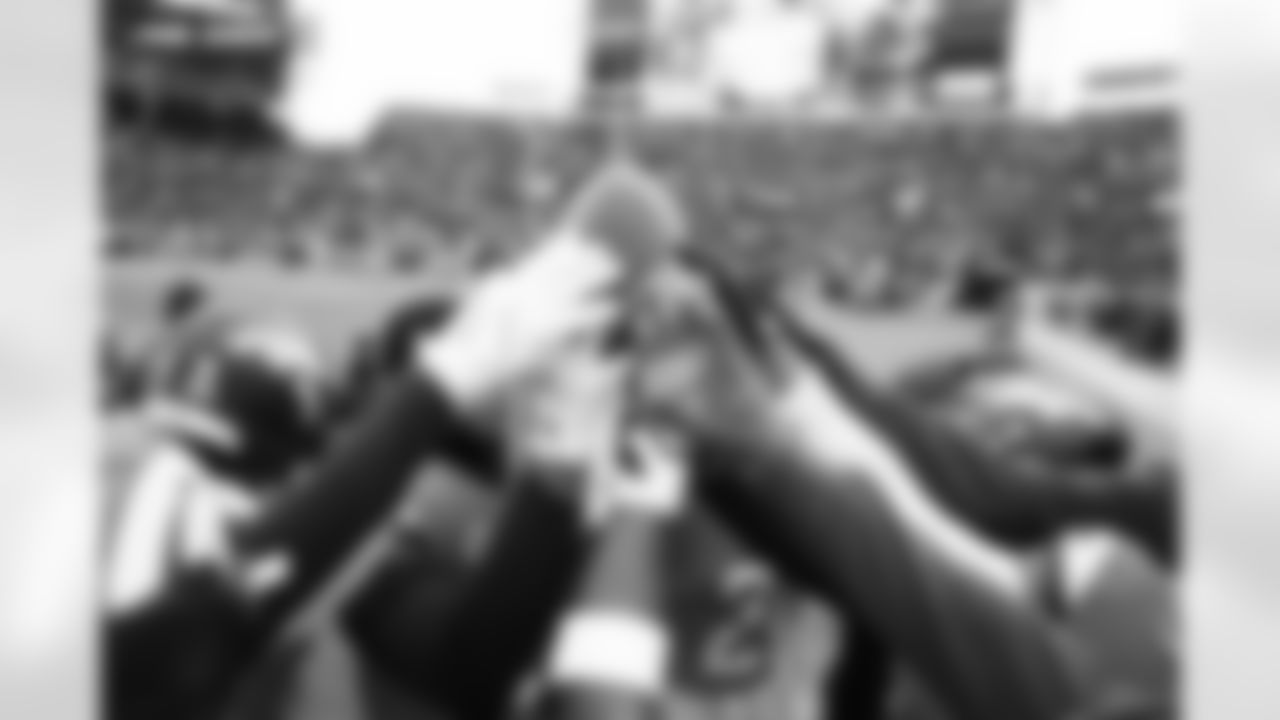 Players huddle  around a football before the AFC Championship Game between the Denver Broncos and New England Patriots at Empower Field at Mile High in Denver, Colorado on January 25, 2026. Photo by Gabriel Christus / Denver Broncos