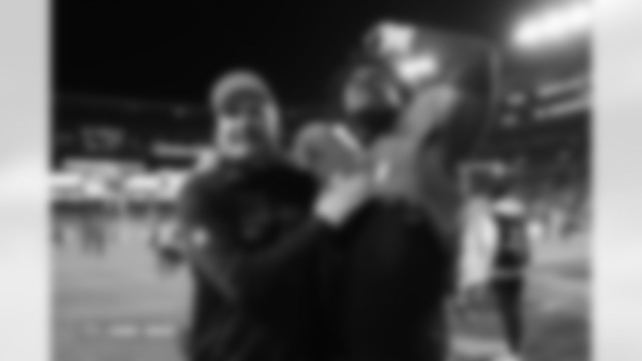 Darren Rizzi and Malcolm Roach during the Broncos' Week 13 game against the Washington Commanders at Northwest Stadium in Landover, Maryland on November 30, 2025. Photo by Ben Swanson / Denver Broncos