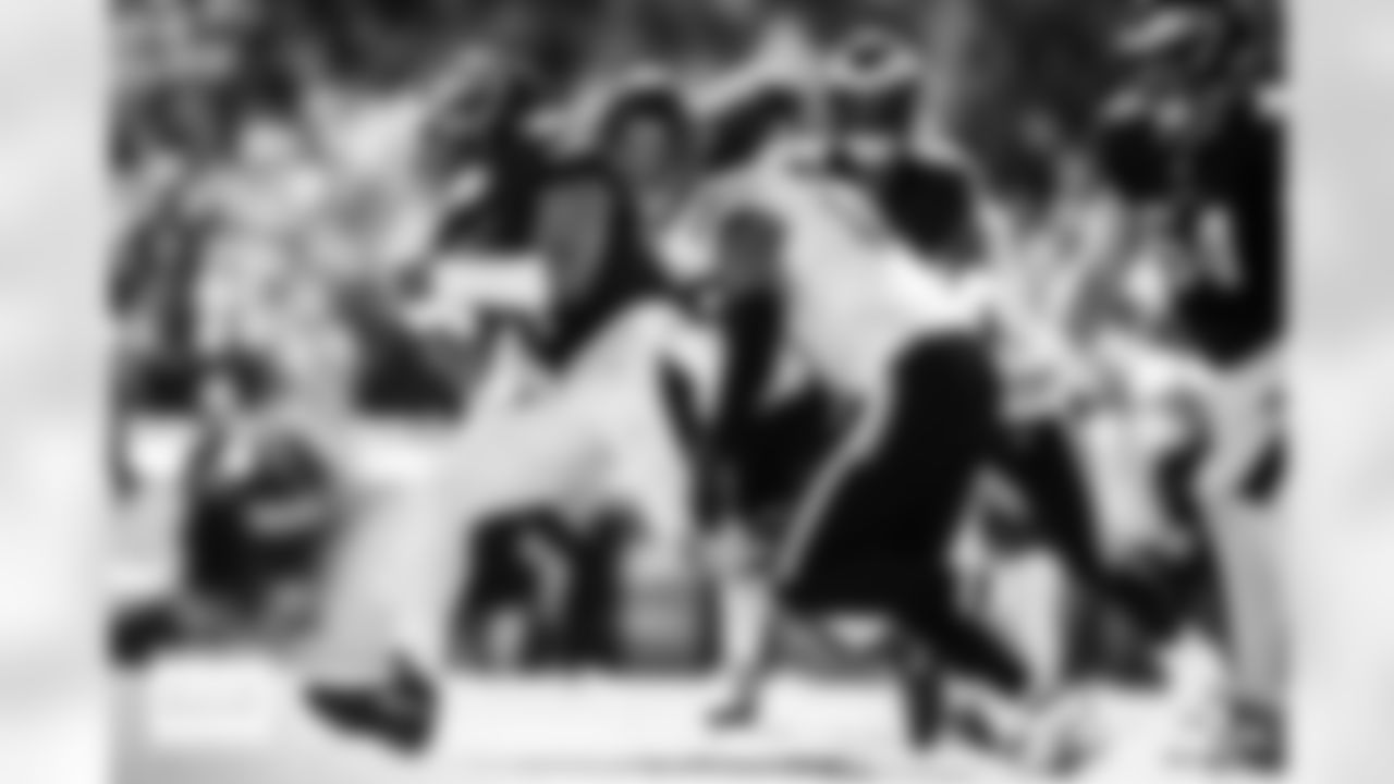 Denver Broncos defensive end Zach Allen (99) and linebacker Nik Bonitto (15) sack Philadelphia Eagles quarterback Jalen Hurts (1) during the Broncos' Week 5 game against the Philadelphia Eagles at Lincoln Financial Field in Philadelphia, Pennsylvania on October 5, 2025. Photo by Gabriel Christus / Denver Broncos