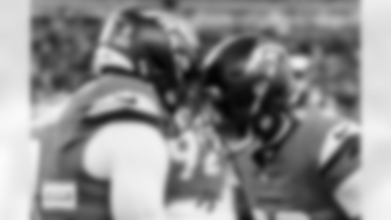 Denver Broncos linebacker Jonathon Cooper (0) and cornerback Ja'Quan McMillian (29) knock helmets before the Broncos' Divisional Round playoff game against the Buffalo Bills at Empower Field at Mile High in Denver, Colorado on January 17, 2026. Photo by Ben Swanson / Denver Broncos
