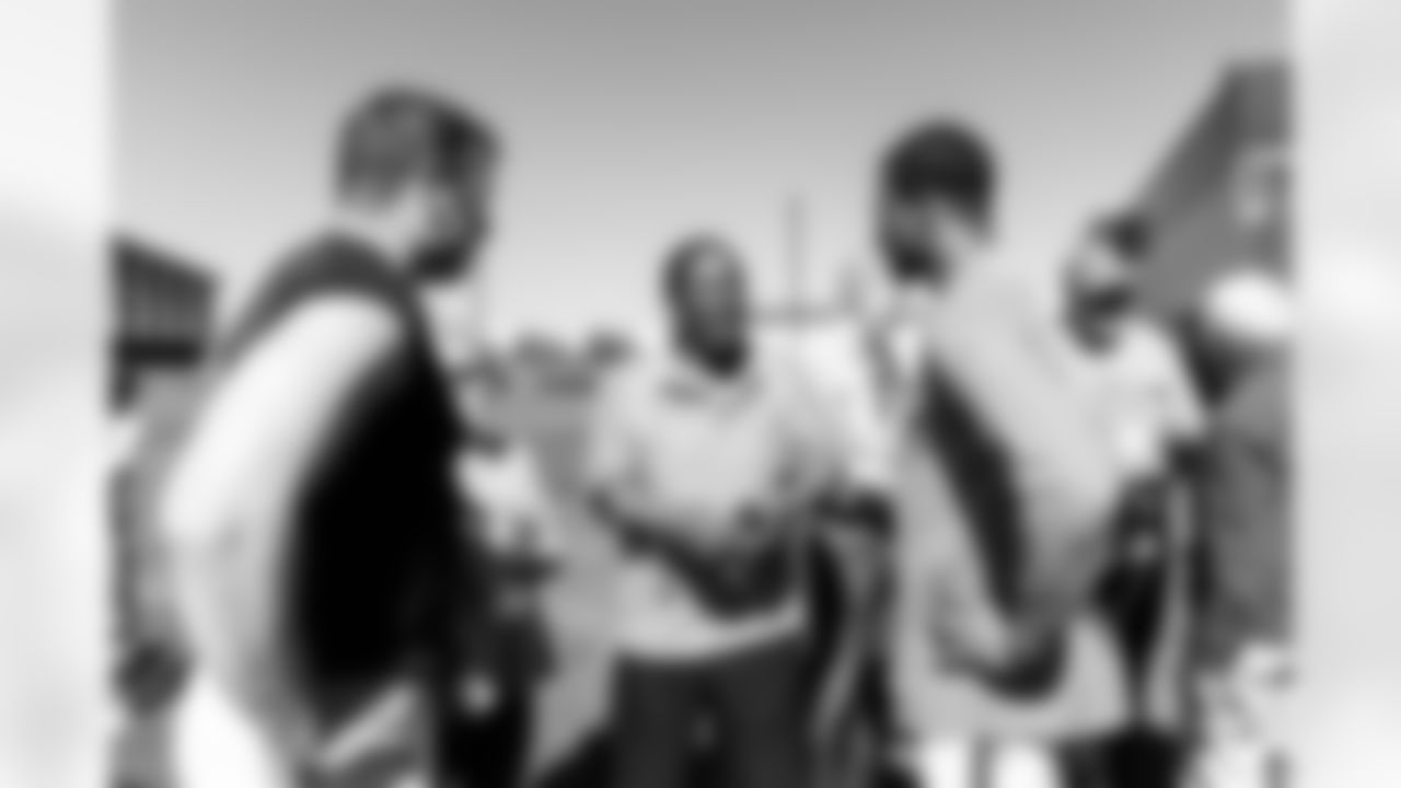 Tom Jackson talks with Zach Allen and Pat Surtain II during an Alumni Weekend visit to practice at Broncos Park Powered by CommonSpirit in Englewood, Colorado on October 5, 2024. Photo by Nicole Pennetta / Denver Broncos