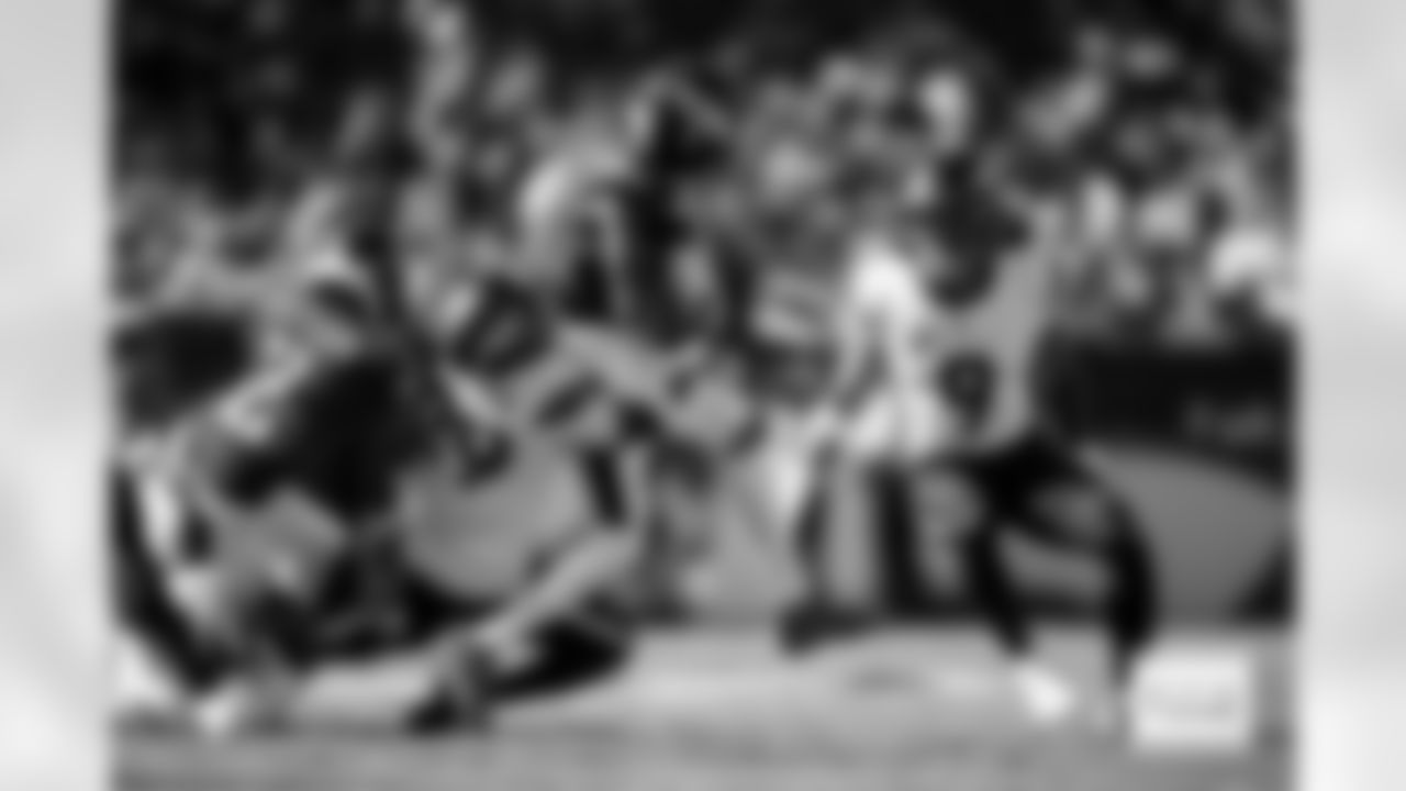 Denver Broncos cornerback Ja'Quan McMillian (29) tackles Philadelphia Eagles wide receiver DeVonta Smith (6) during the Broncos' Week 5 game against the Philadelphia Eagles at Lincoln Financial Field in Philadelphia, Pennsylvania on October 5, 2025. Photo by Gabriel Christus / Denver Broncos