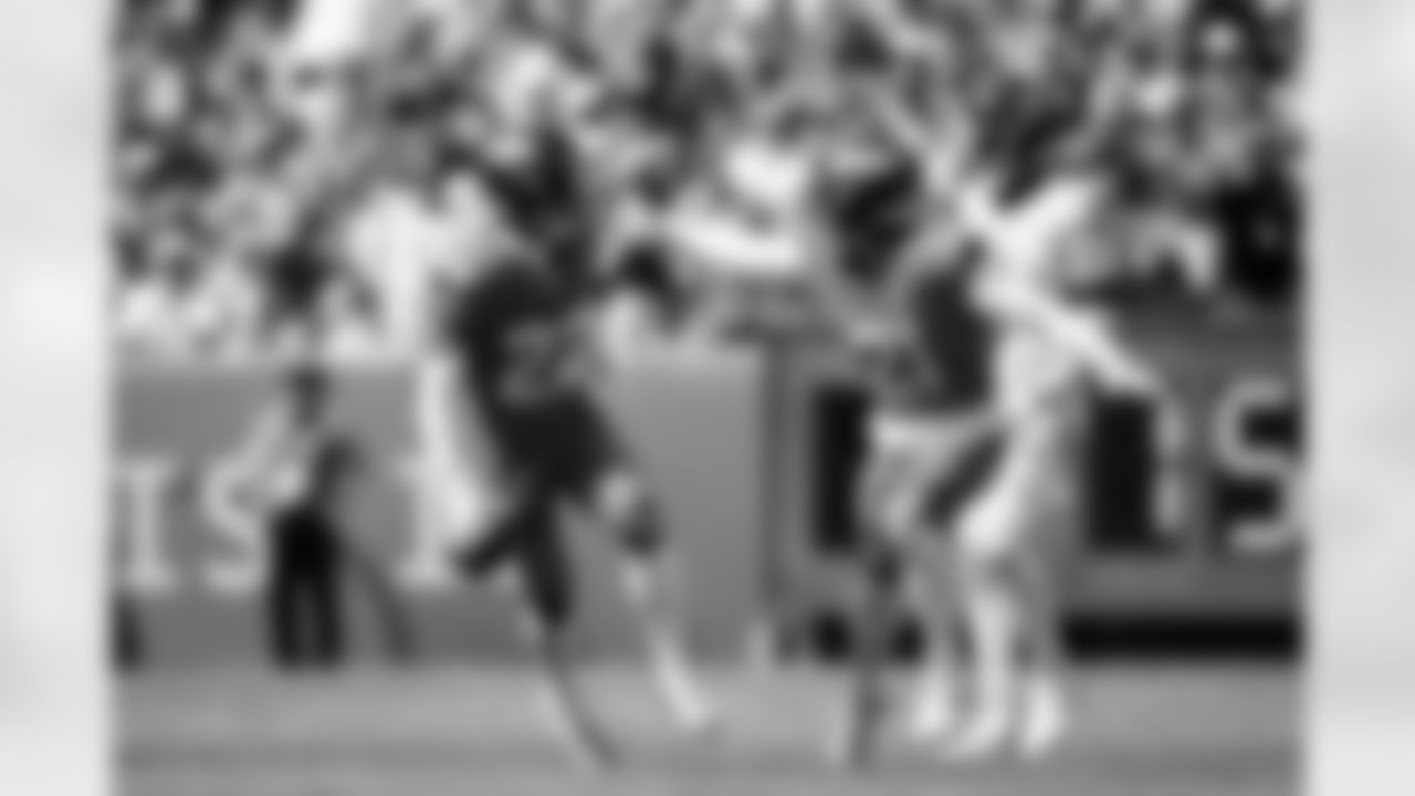 Denver Broncos safety Brandon Jones (22) and cornerback Riley Moss (21) celebrate after a fumble recovery during the Broncos' Week 1 game against the Tennessee Titans at Empower Field at Mile High in Denver, Colorado on September 7, 2025. Photo by Ben Swanson / Denver Broncos