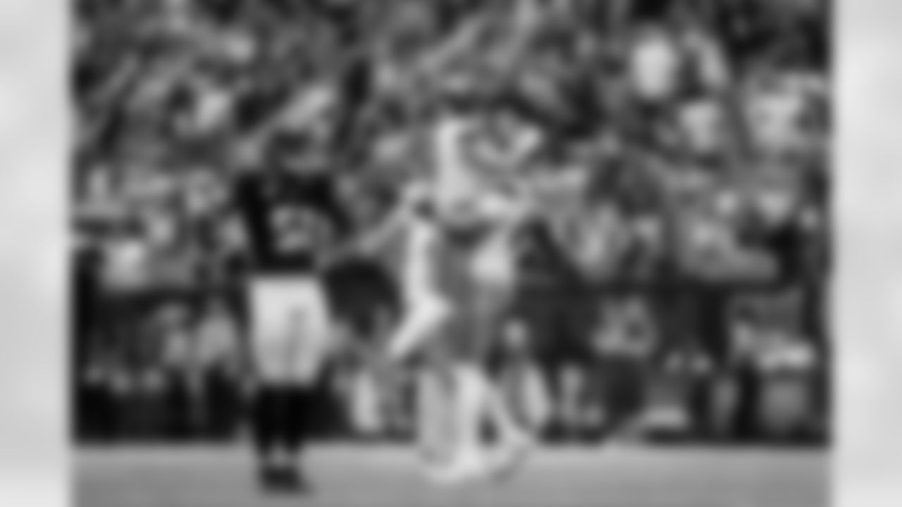 Denver Broncos quarterback Bo Nix (10) celebrates with offensive tackle Mike McGlinchey (69) after a touchdown during the Broncos' Week 9 game against the Houston Texans at NRG Stadium in Houston, Texas on November 2, 2025. Photo by Ben Swanson / Denver Broncos