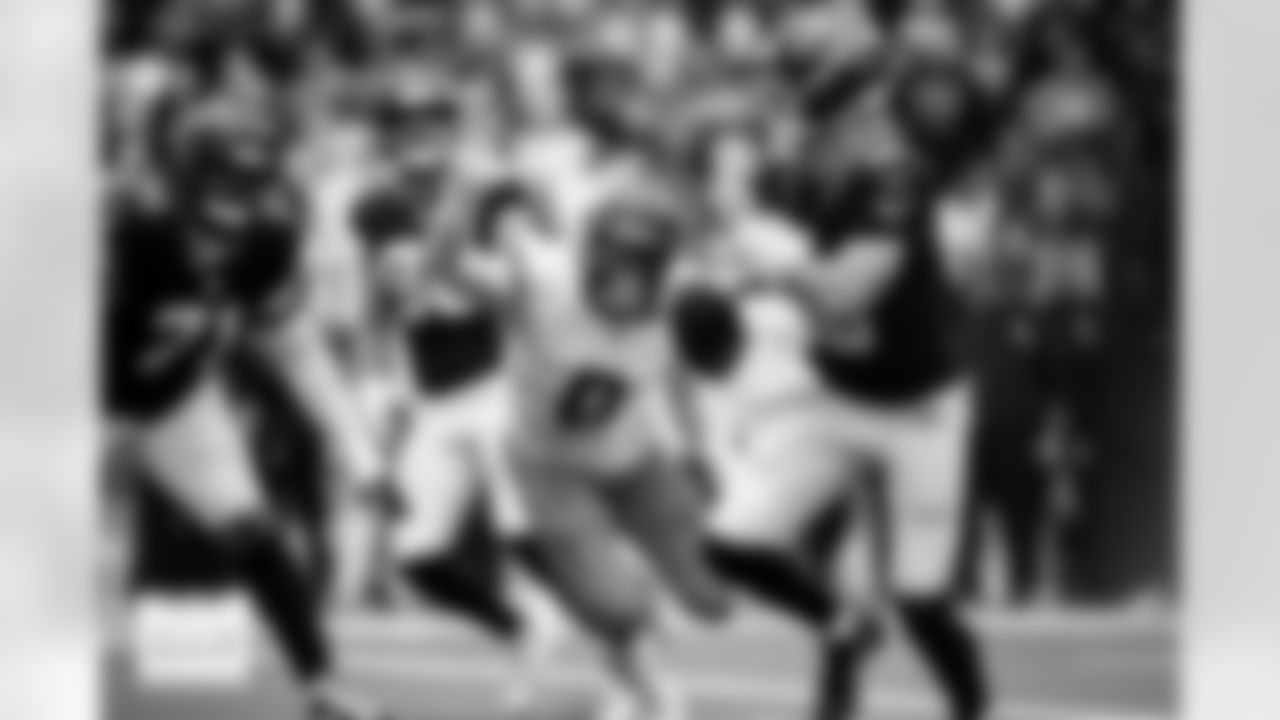 Denver Broncos linebacker Jonathon Cooper (0) chases Houston Texans quarterback Davis Mills (10) for a sack during the Broncos' Week 9 game against the Houston Texans at NRG Stadium in Houston, Texas on November 2, 2025. Photo by Ben Swanson / Denver Broncos