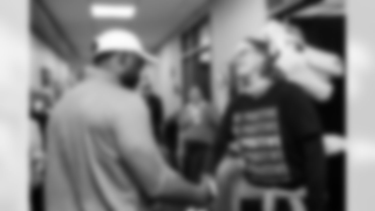 The Broncos help celebrate a patient's final appointment during a visit to CommonSpirit's St. Anthony Hospital in Lakewood, Colorado on October 21, 2025. Photo by Ben Swanson / Denver Broncos