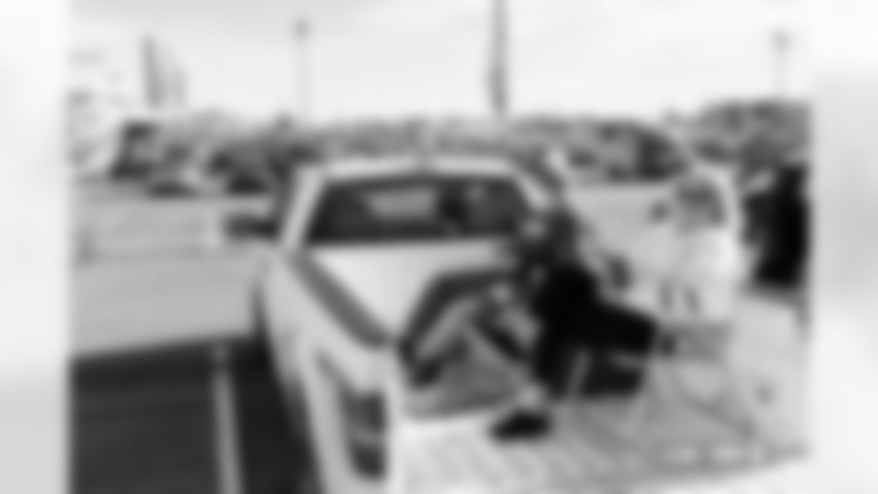 Fans tailgate in a truck bed before the Broncos' Week 18 game against the Los Angeles Chargers at Empower Field at Mile High in Denver, Colorado on January 4, 2026. Photo by Ben Swanson / Denver Broncos