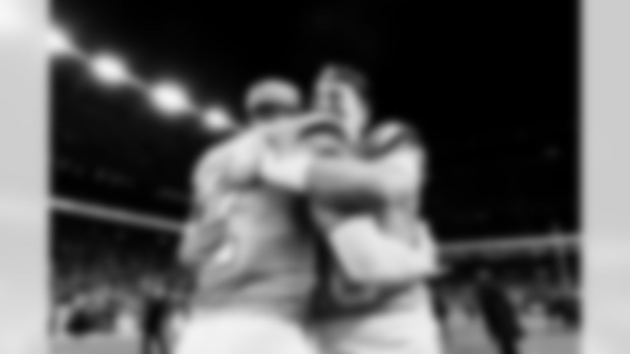 Denver Broncos cornerback Pat Surtain II (2) and quarterback Bo Nix (10) embrace after the Broncos' Divisional Round playoff game against the Buffalo Bills at Empower Field at Mile High in Denver, Colorado on January 17, 2026. Photo by Gavin Liddell / Denver Broncos