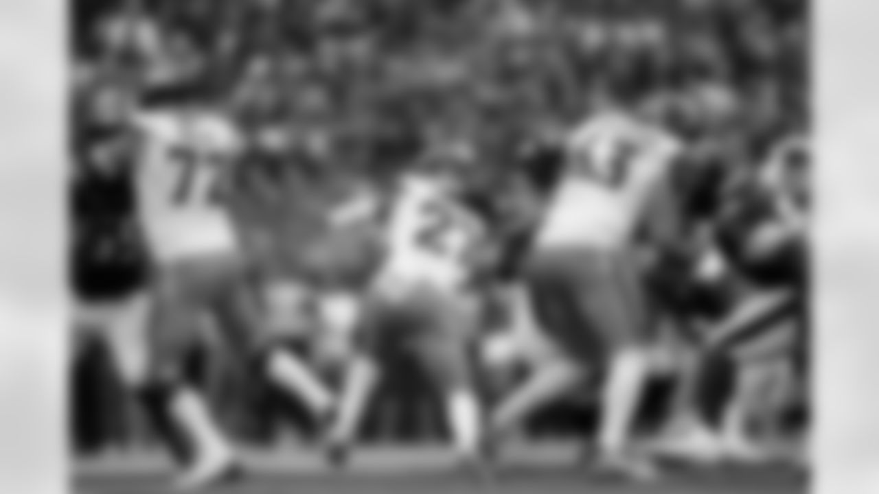 Denver Broncos running back J.K. Dobbins (27) runs through a hole that offensive tackle Garett Bolles (72) and offensive tackle Alex Palczewski (63) created during the Broncos' Week 9 game against the Houston Texans at NRG Stadium in Houston, Texas on November 2, 2025. Photo by Gabriel Christus / Denver Broncos