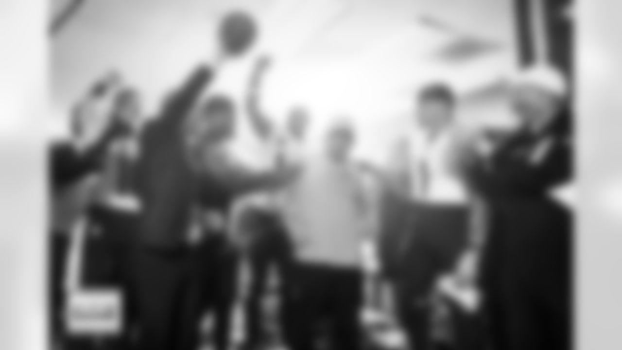 Greg Penner gives a game ball to Sean Payton in the locker room after the Broncos' Week 5 game against the Philadelphia Eagles at Lincoln Financial Field in Philadelphia, Pennsylvania on October 5, 2025. Photo by Gabriel Christus / Denver Broncos