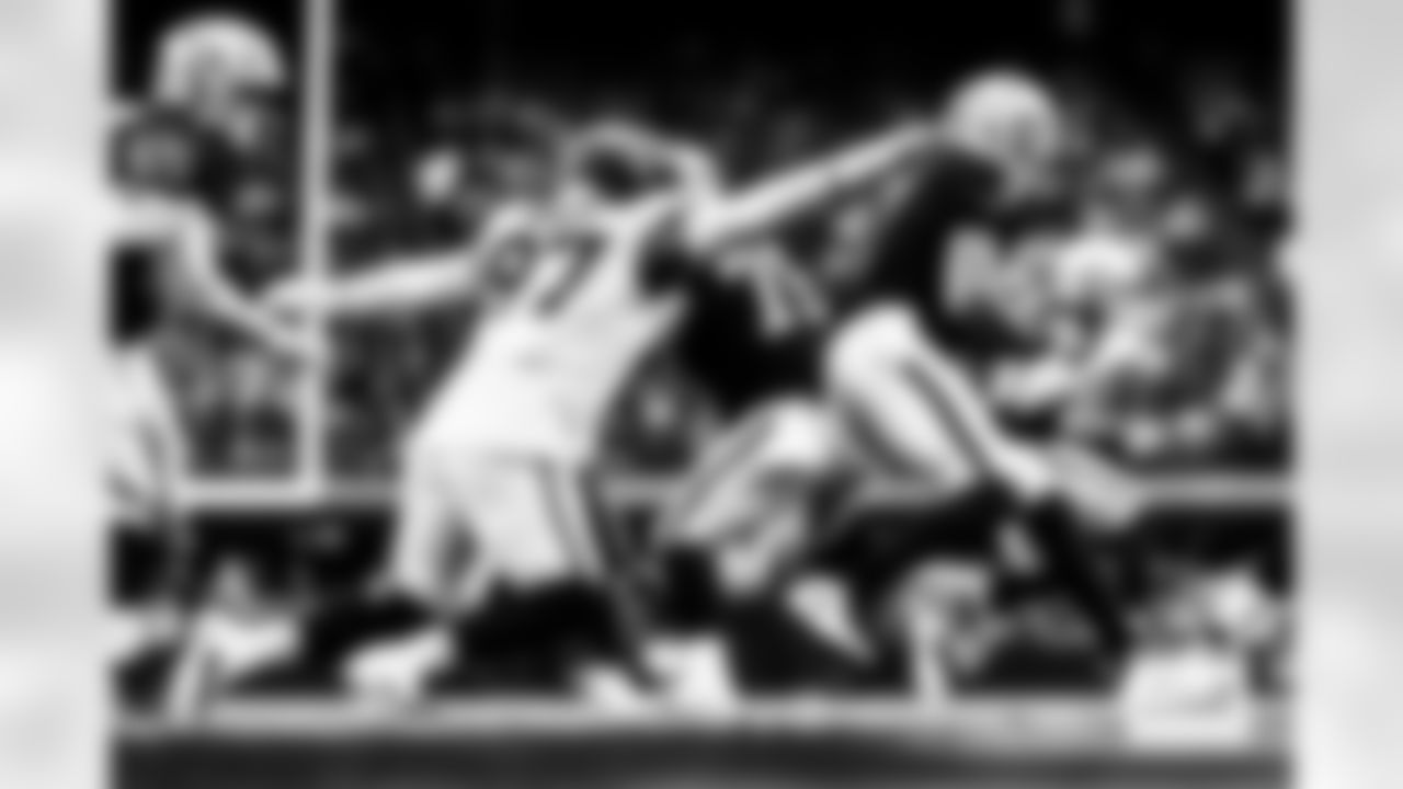 Denver Broncos defensive tackle Malcolm Roach (97) sacks Las Vegas Raiders quarterback Geno Smith (7) during the Broncos' Week 14 game against the Las Vegas Raiders at Allegiant Stadium in Las Vegas, Nevada on December 7, 2025. Photo by Ben Swanson / Denver Broncos