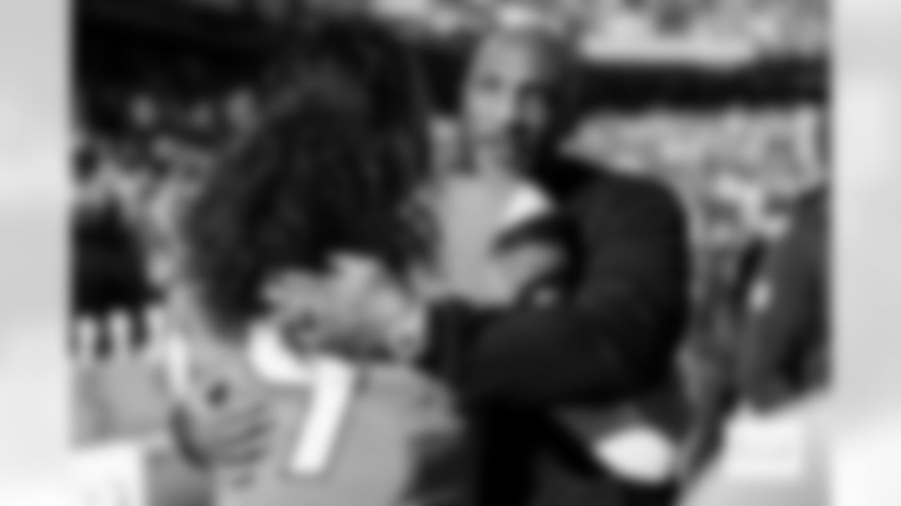 Denver Broncos safety Talanoa Hufanga (9) greets Aqib Talib before the Broncos' Divisional Round playoff game against the Buffalo Bills at Empower Field at Mile High in Denver, Colorado on January 17, 2026. Photo by Ben Swanson / Denver Broncos