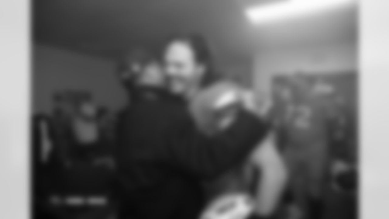 Greg Penner and Alex Singleton in the locker room after the Broncos' Week 13 game against the Washington Commanders at Northwest Stadium in Landover, Maryland on November 30, 2025. Photo by Gabriel Christus / Denver Broncos