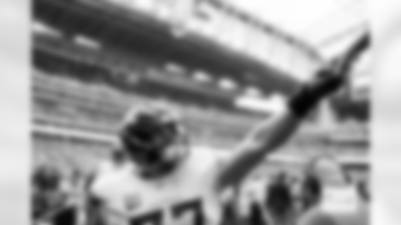 Denver Broncos guard Quinn Meinerz (77) fist-bumps a fan before the Broncos' Week 9 game against the Houston Texans at NRG Stadium in Houston, Texas on November 2, 2025. Photo by Gabriel Christus / Denver Broncos