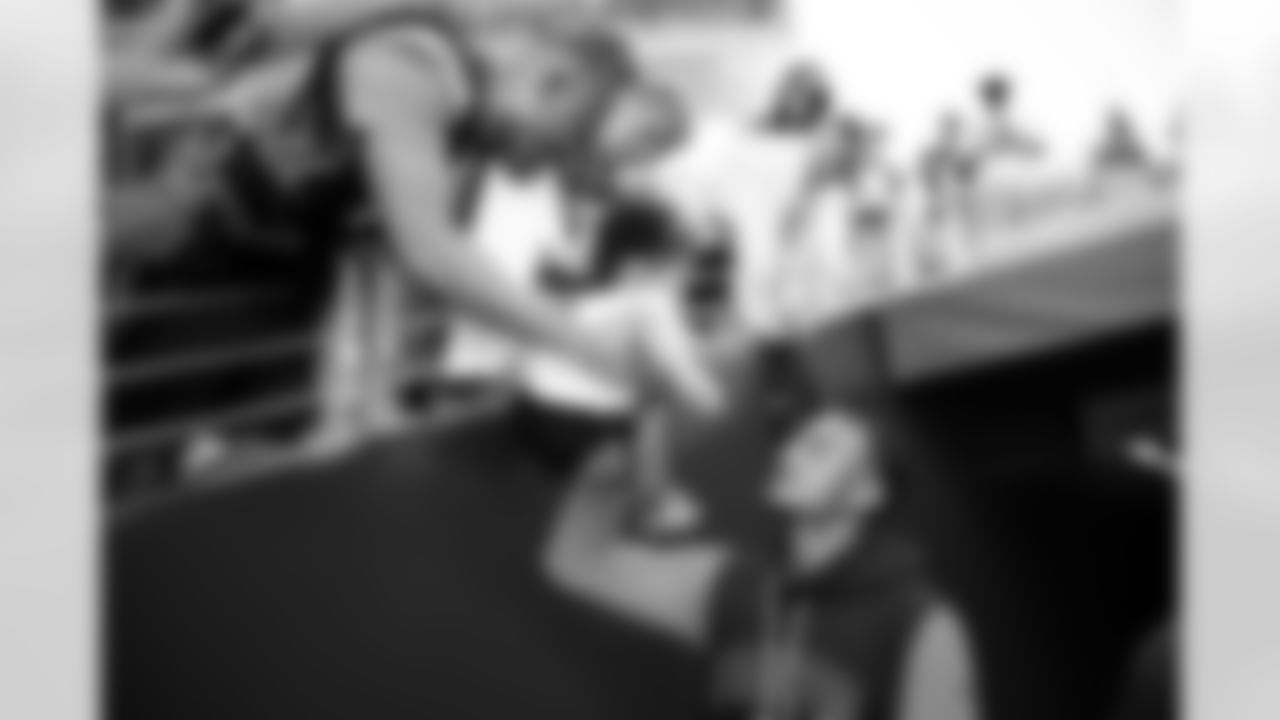 Pat Surtain II autographs a fan's baby before the Broncos' preseason Week 1 game against the San Francisco 49ers at Levi's Stadium in Santa Clara, California on August 9, 2025. Photo by Ben Swanson / Denver Broncos