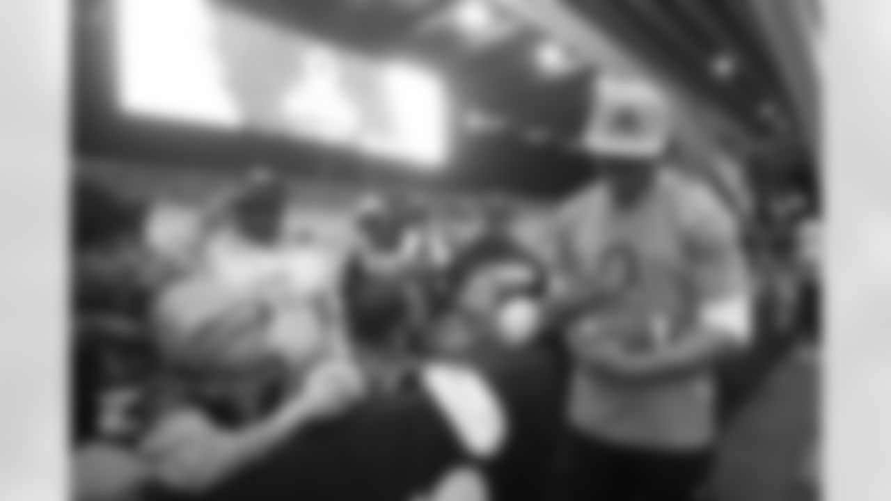 AFC cornerback Patrick Surtain II, of the Denver Broncos, right, signs autographs for fans during NFL Pro Bowl Games practice in San Francisco, Sunday, Feb. 1, 2026. (AP Photo/Jeff Chiu)