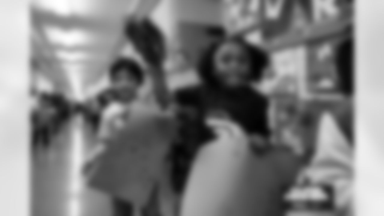 Students cheer on the Broncos during a school hallway parade to celebrate the Denver Broncos making the playoffs at Doull Elementary School in Denver, Colorado on January 16, 2026. Photo by Ben Swanson / Denver Broncos