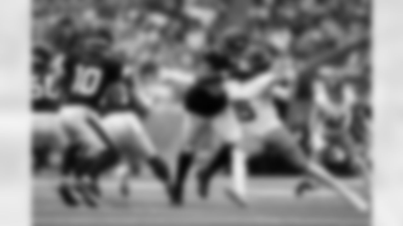 Denver Broncos linebacker Nik Bonitto (15) works against Houston Texans offensive tackle Blake Fisher (57) to pressure quarterback Davis Mills (10) during the Broncos' Week 9 game against the Houston Texans at NRG Stadium in Houston, Texas on November 2, 2025. Photo by Ben Swanson / Denver Broncos