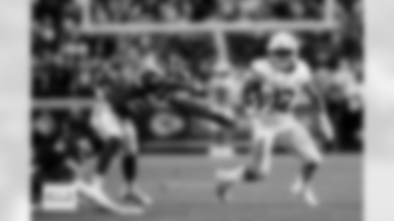 Denver Broncos running back RJ Harvey (12) runs with the ball on a reception and eludes two defenders during the Broncos' Week 17 game against the Kansas City Chiefs at GEHA Field at Arrowhead Stadium in Kansas City, Missouri on December 25, 2025. Photo by Ben Swanson / Denver Broncos