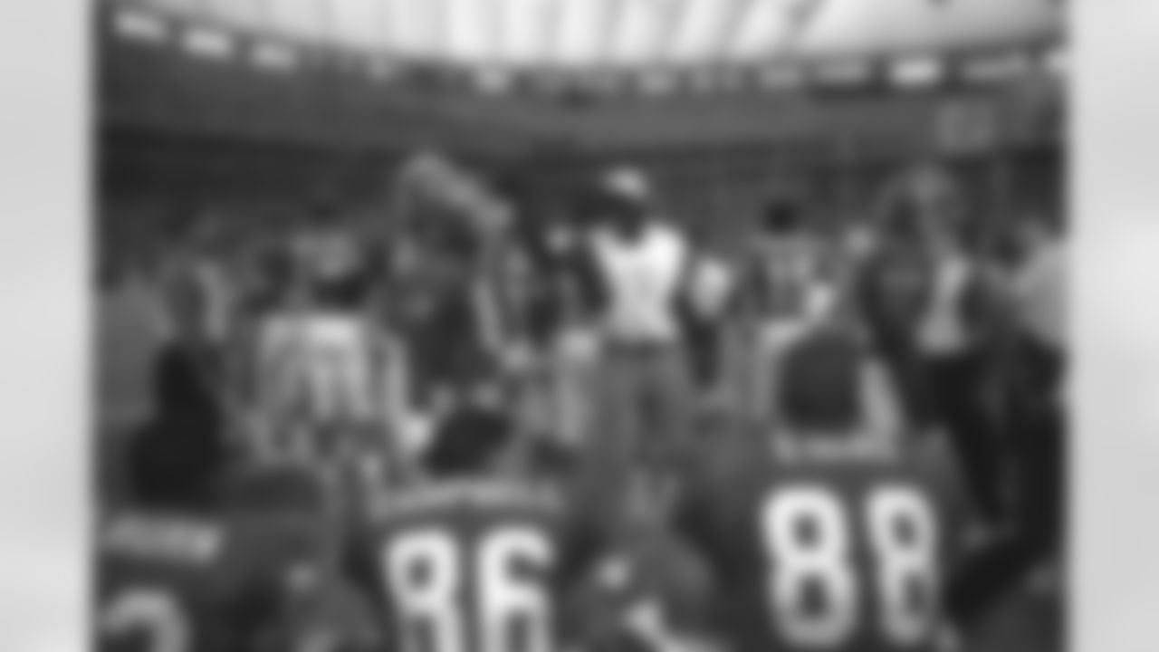 Wide receiver Mike Pritchard celebrates on the sideline at the 1995 American Bowl in Tokyo.