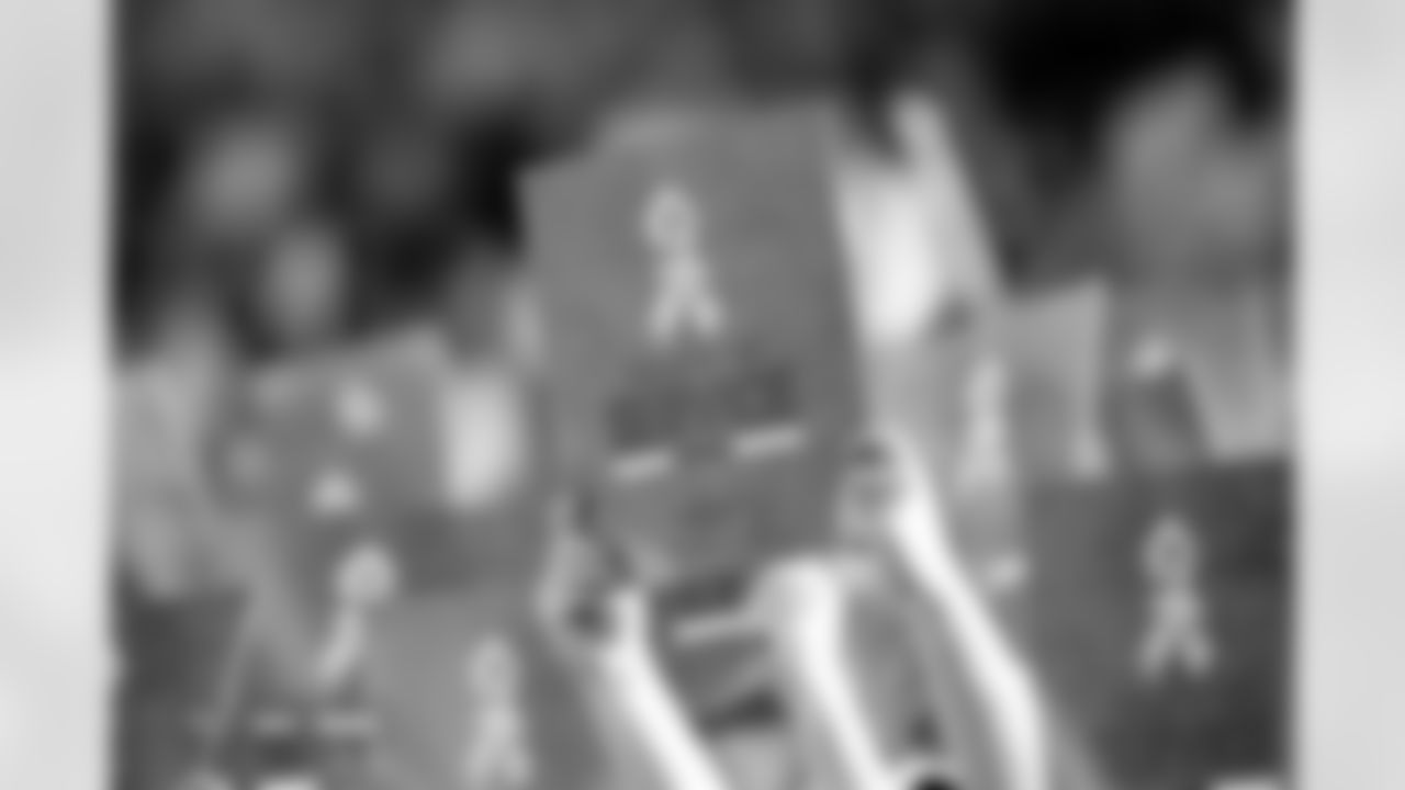 Fans hold up Salute to Service cards before the Broncos' Week 11 game against the Kansas City Chiefs at Empower Field at Mile High in Denver, Colorado on November 16, 2025. Photo by Ben Swanson / Denver Broncos