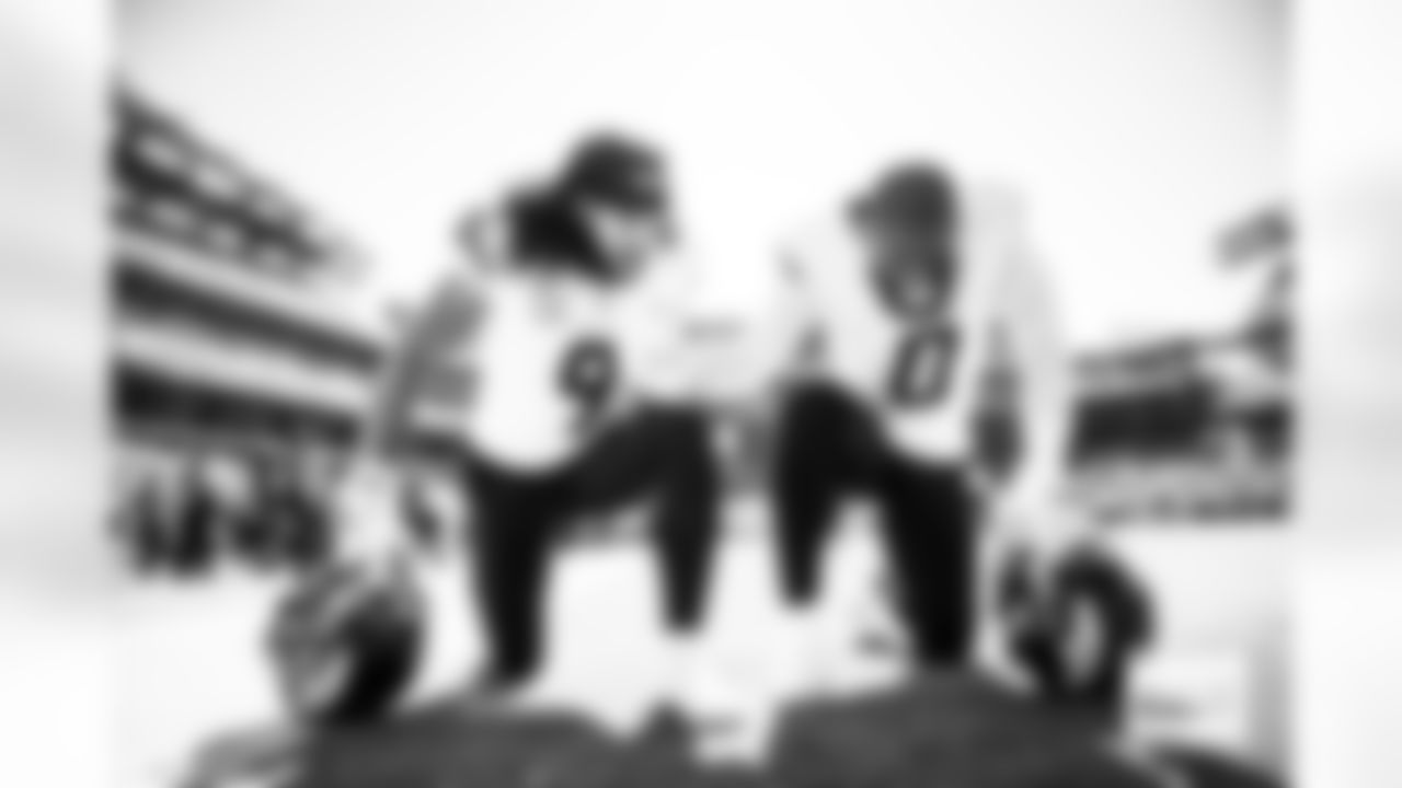 Denver Broncos safety Talanoa Hufanga (9) and linebacker Jonathon Cooper (0) pray together before the Broncos' Week 5 game against the Philadelphia Eagles at Lincoln Financial Field in Philadelphia, Pennsylvania on October 5, 2025. Photo by Ben Swanson / Denver Broncos