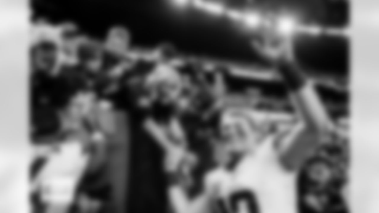 Denver Broncos quarterback Bo Nix (10) high-fives fans and waves after the Broncos' Week 14 game against the Las Vegas Raiders at Allegiant Stadium in Las Vegas, Nevada on December 7, 2025. Photo by Ben Swanson / Denver Broncos