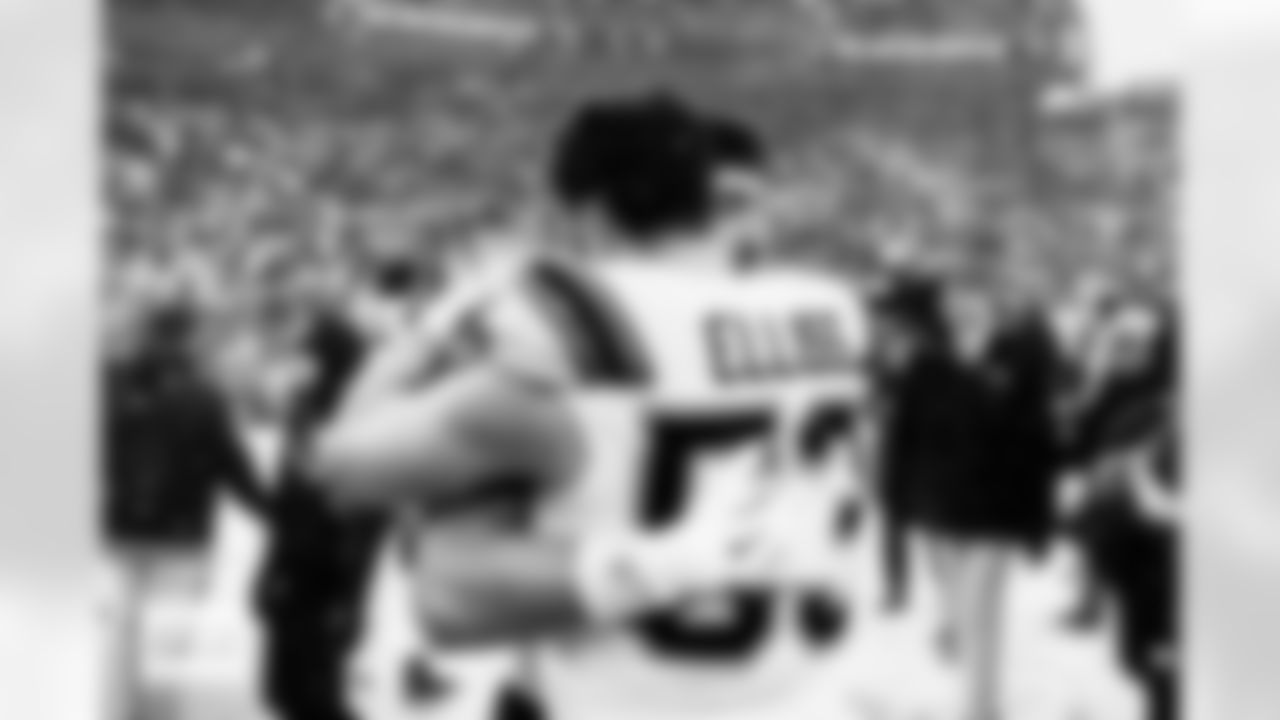 Denver Broncos linebacker Jonah Elliss (52) hugs his brother New England Patriots linebacker Christian Elliss (53) after the AFC Championship Game between the Denver Broncos and New England Patriots at Empower Field at Mile High in Denver, Colorado on January 25, 2026. Photo by Ben Swanson / Denver Broncos