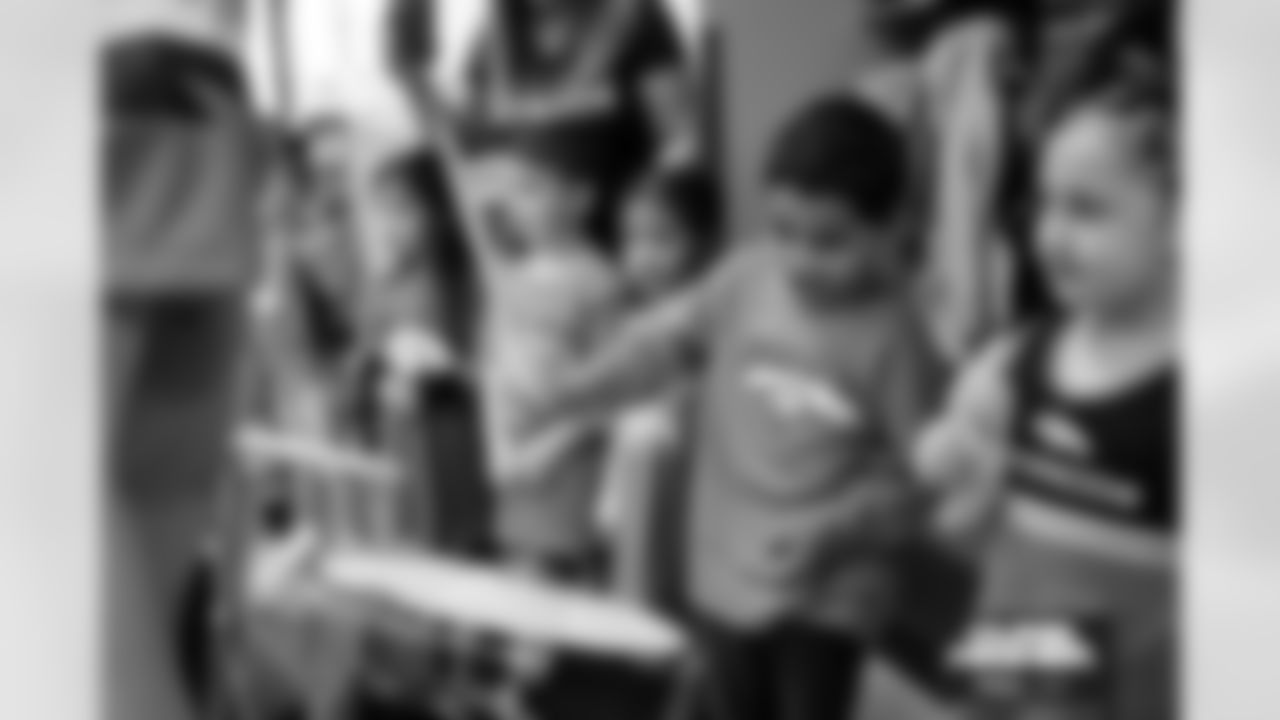 Students cheer on the Broncos during a school hallway parade to celebrate the Denver Broncos making the playoffs at Godsman Elementary School in Denver, Colorado on January 16, 2026. Photo by Ben Swanson / Denver Broncos