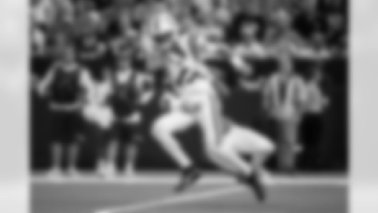 Denver Broncos linebacker Jonah Elliss (52) tackles Indianapolis Colts quarterback Daniel Jones (17) during the Broncos' Week 2 game against the Indianapolis Colts at Lucas Oil Stadium in Indianapolis, Indiana on September 14, 2025. Photo by Ben Swanson / Denver Broncos