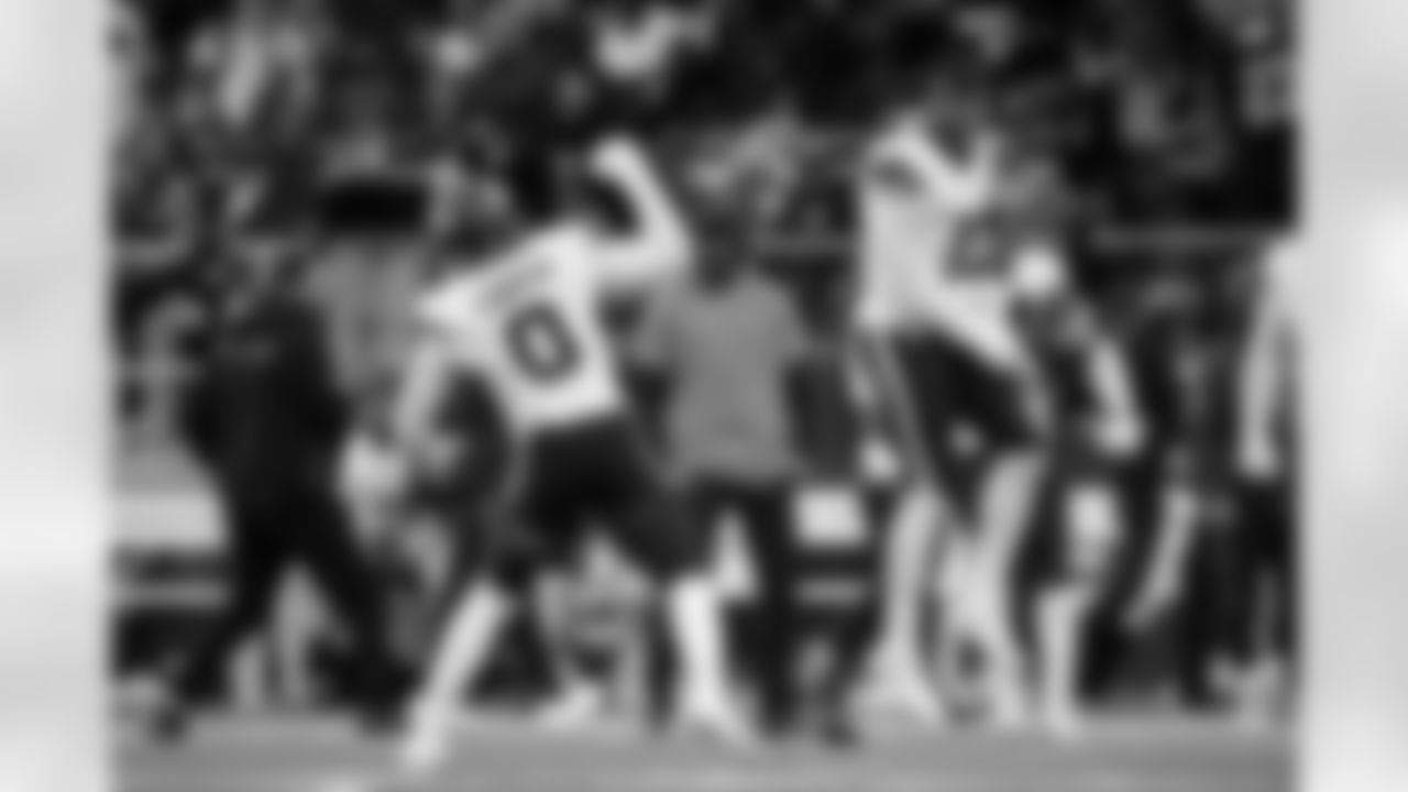 Denver Broncos linebacker Nik Bonitto (15) celebrates with linebacker Jonathon Cooper (0) during the Broncos' Week 6 game against the New York Jets at Tottenham Hotspur Stadium in London, England on October 12, 2025. Photo by Ben Swanson / Denver Broncos