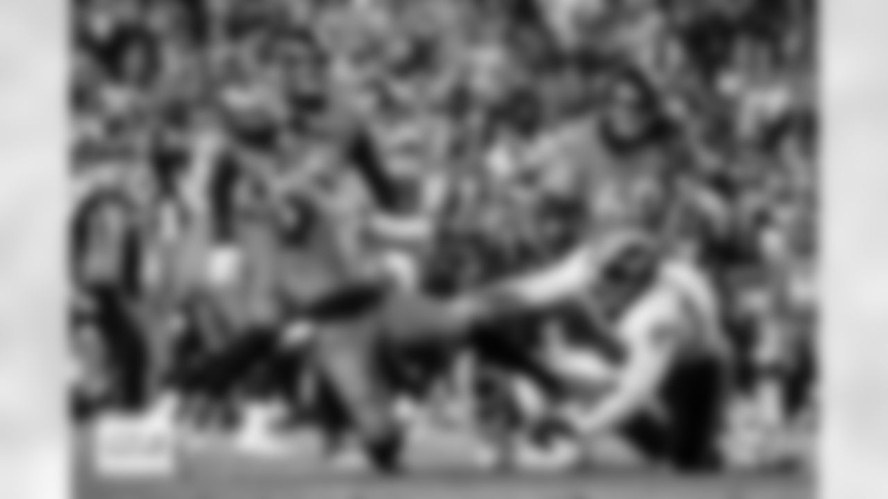 Denver Broncos quarterback Bo Nix (10) throws a touchdown pass while falling down during the Broncos' Week 13 game against the Washington Commanders at Northwest Stadium in Landover, Maryland on November 30, 2025. Photo by Ben Swanson / Denver Broncos