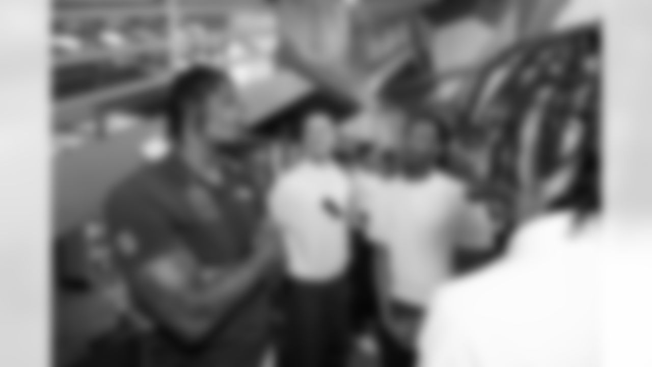 ChangeMakers talk with Pat Bryant during a visit to the Arkansas Valley Correctional Facility in Ordway, Colorado on October 14, 2025. In partnership with the Vera Institute of Justice, the Denver Broncos Foundation toured ChangeMakers Village (a Restoring Promise Unit).Photo by Gabriel Christus / Denver Broncos