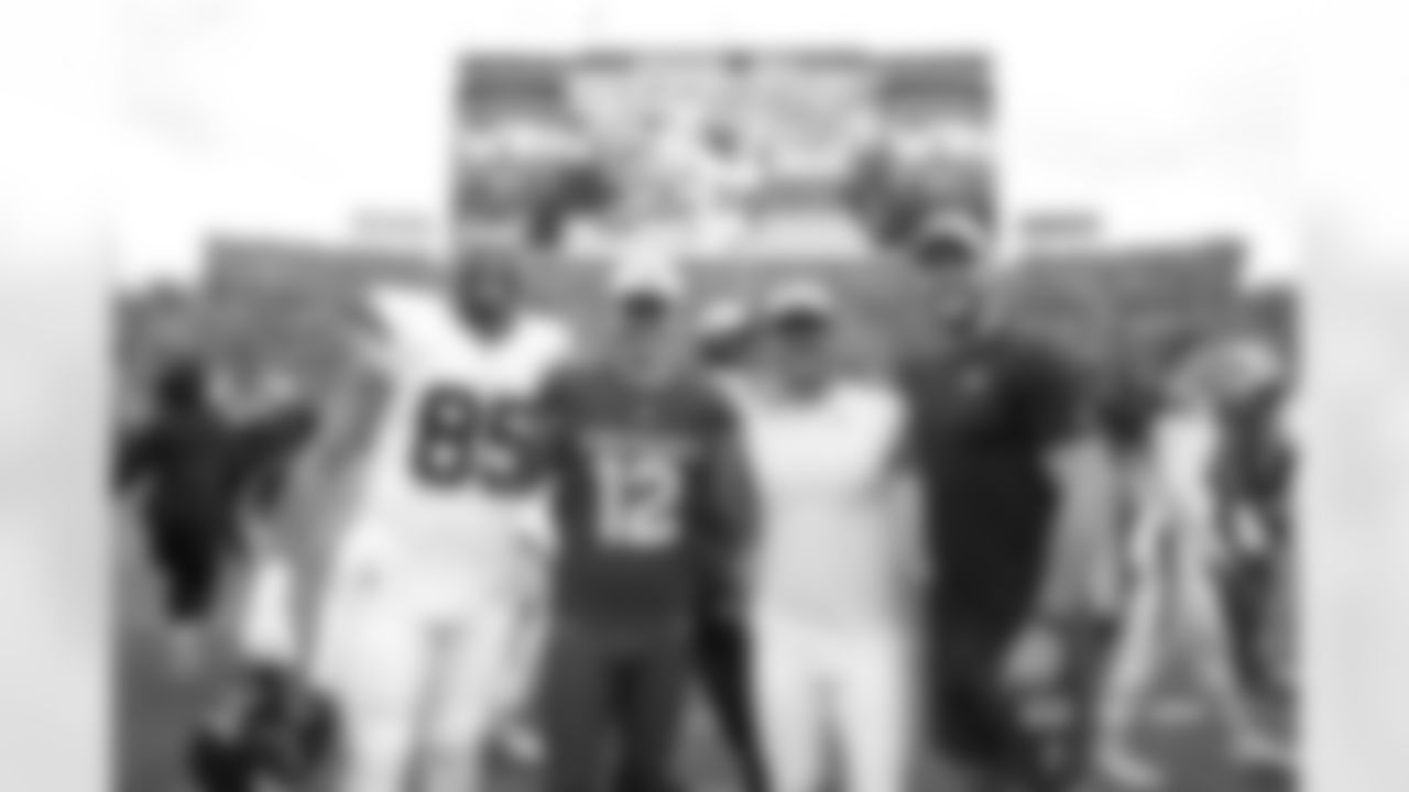 Lucas Krull #85 of the Denver Broncos and Blake Gillikin #12 of the Arizona Cardinals pose for a photo with Wil Lutz and Adam Trautman after the Broncos' Preseason Week 3 game against the Arizona Cardinals at Empower Field At Mile High on August 25, 2024 in Denver, Colorado. (Photo by Rachel O'Driscoll/Denver Broncos)