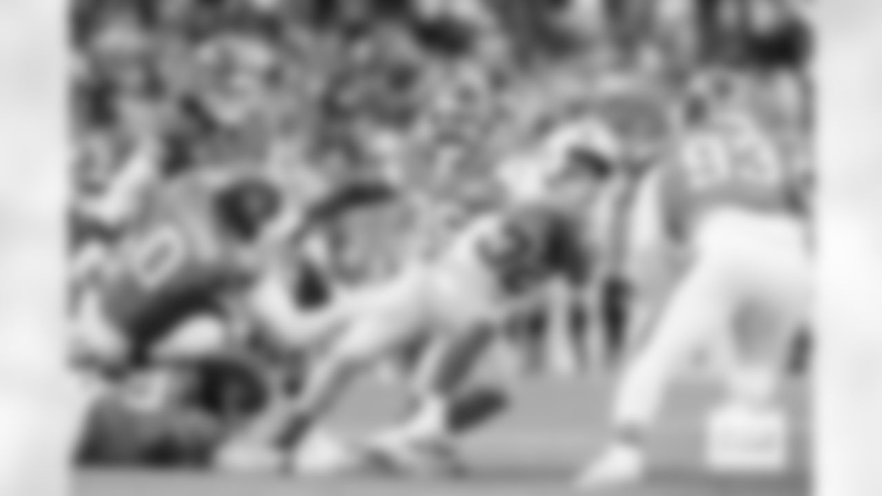 Eyioma Uwazurike tackles Jaret Patterson during the Broncos' Week 18 game against the Los Angeles Chargers at Empower Field at Mile High in Denver, Colorado on January 4, 2026. Photo by Gabriel Christus / Denver Broncos